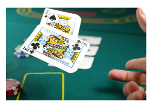 https://unsplash.com/photos/person-playing-poker-oT-XbATcoTQ